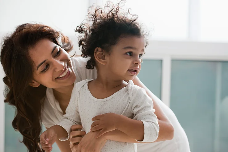 A woman holding a child